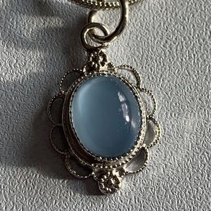 Beautiful delicate vintage baby blue moon glow sterling pendant.
